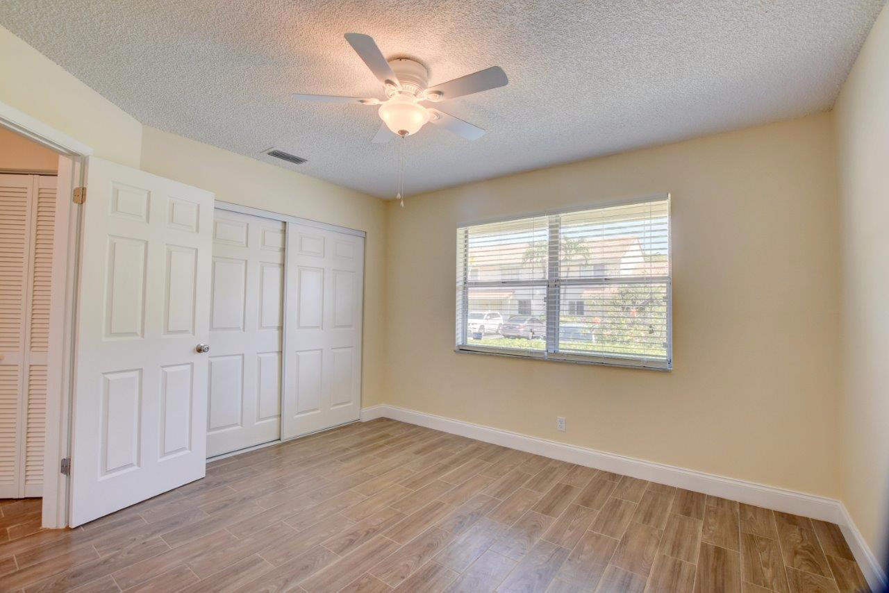 6350 Walk Circle Boca Raton, FL 33433 - Photo 18 of 29 wooden floor in an empty room with a window