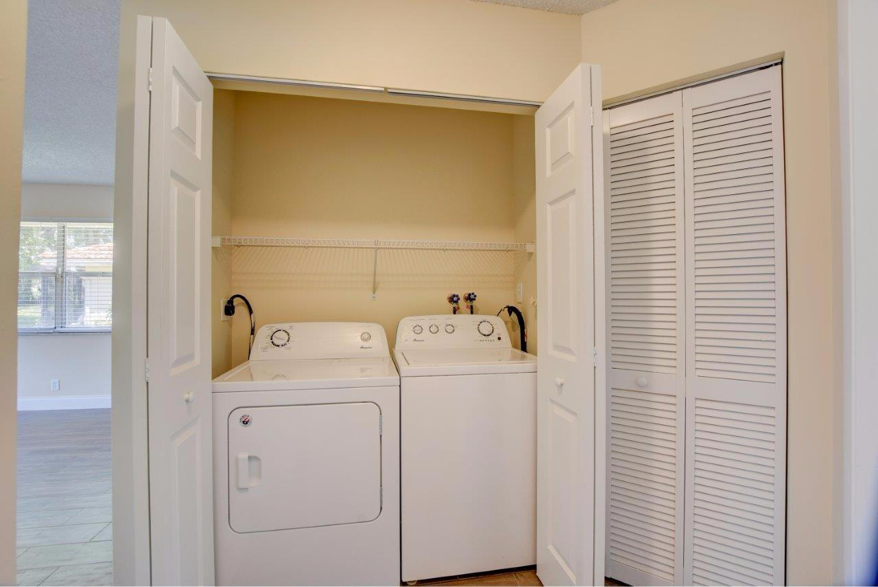 6350 Walk Circle Boca Raton, FL 33433 - Photo 19 of 29 a utility room with dryer and washer