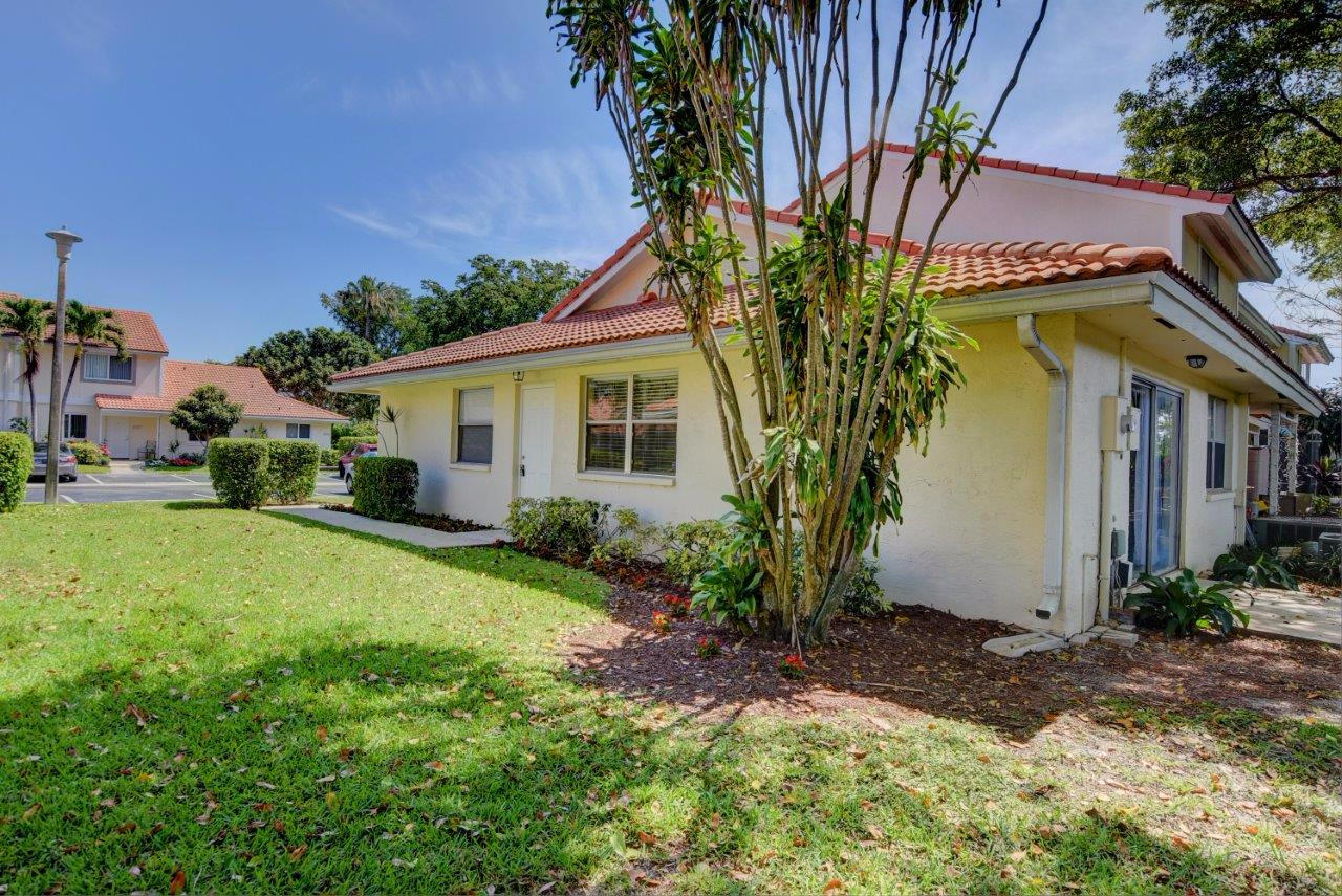 6350 Walk Circle Boca Raton, FL 33433 - Photo 24 of 29 a view of a house with a yard