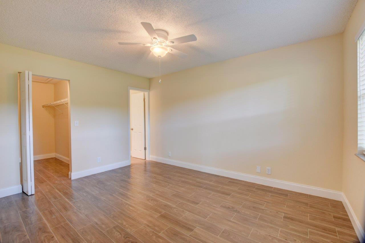 6350 Walk Circle Boca Raton, FL 33433 - Photo 6 of 29 a view of an empty room with wooden floor