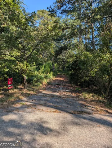 a view of a yard with a tree
