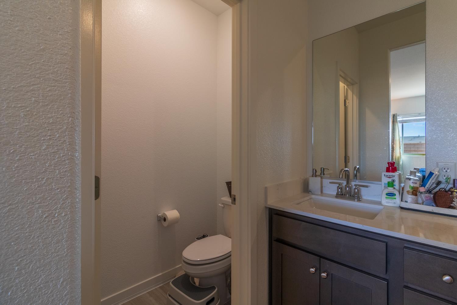 12868 Spotted Wren Circle Rancho Cordova, CA 95742 - Photo 13 of 46 a bathroom with a sink and a mirror