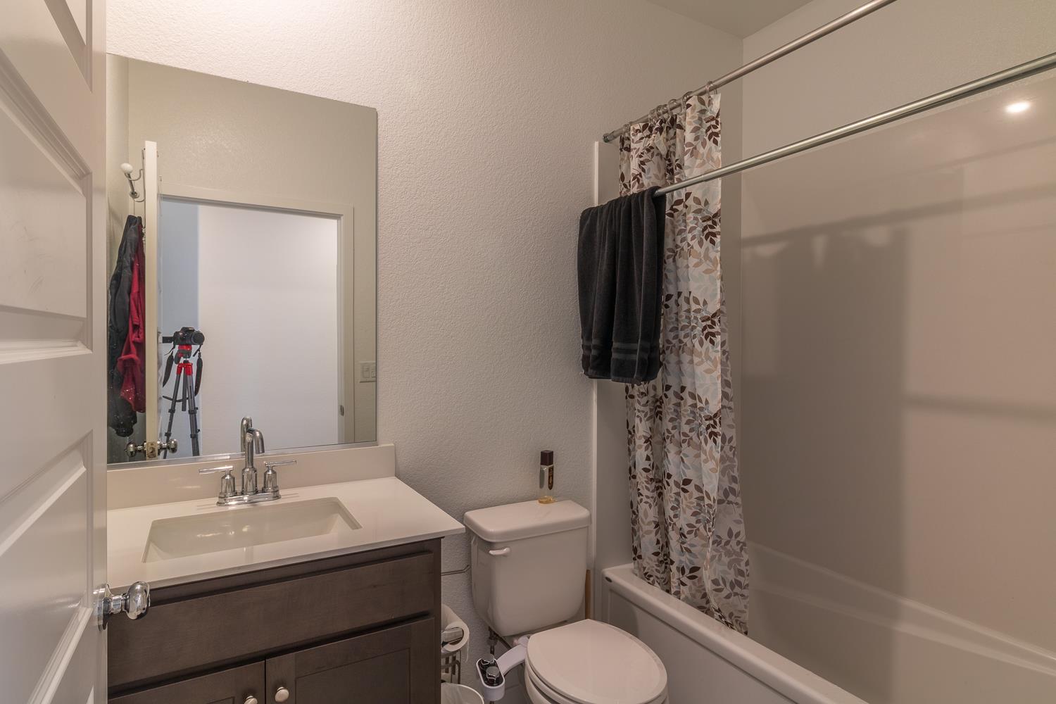 12868 Spotted Wren Circle Rancho Cordova, CA 95742 - Photo 16 of 46 a bathroom with a sink toilet and shower