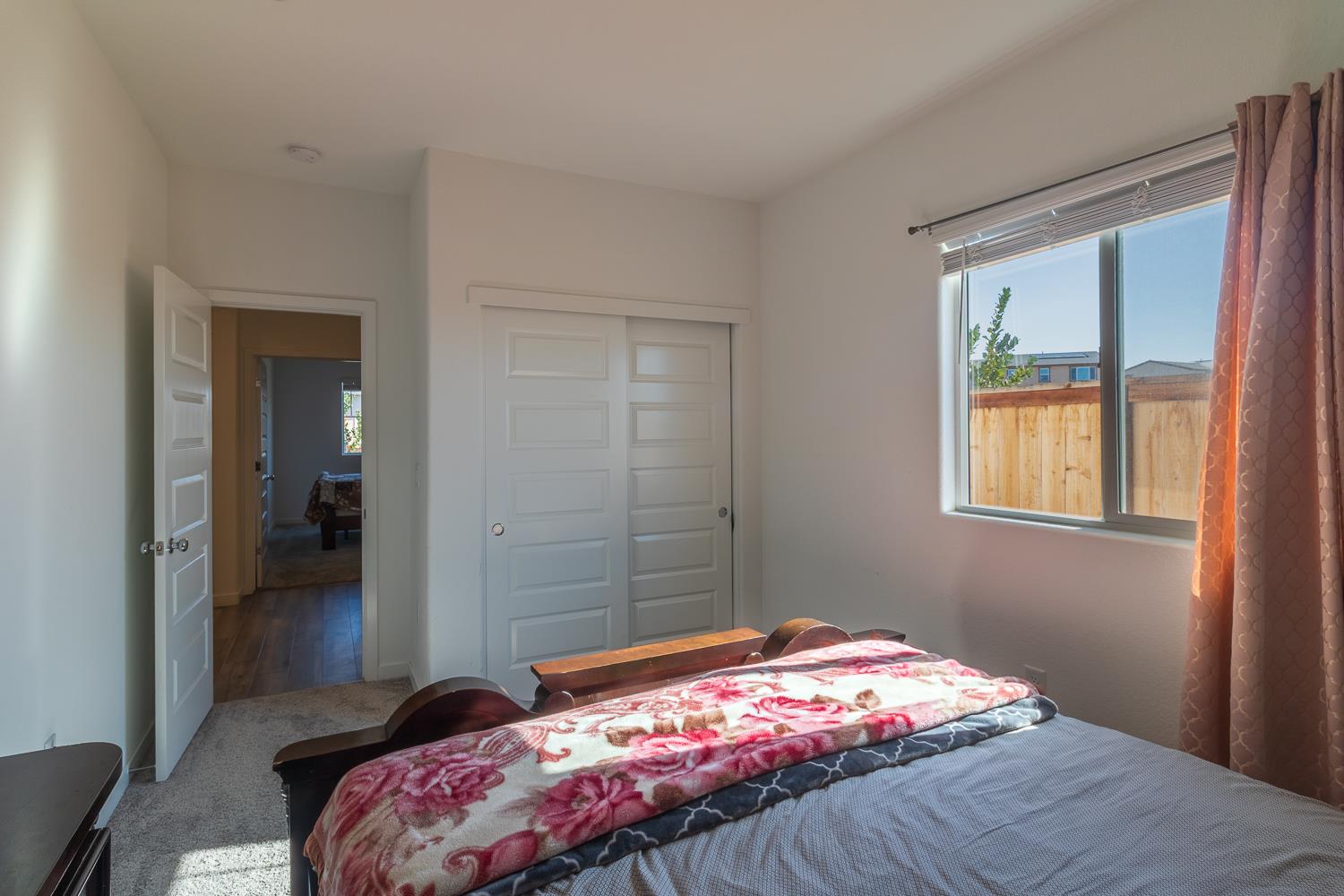 12868 Spotted Wren Circle Rancho Cordova, CA 95742 - Photo 17 of 46 a bedroom with a bed and a window