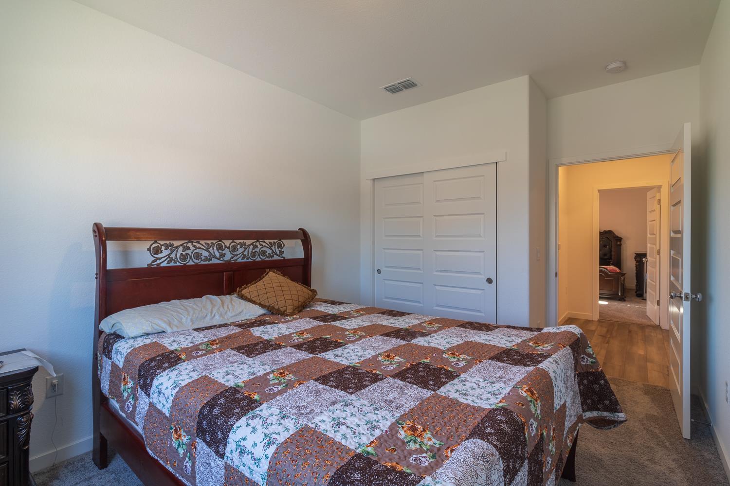 12868 Spotted Wren Circle Rancho Cordova, CA 95742 - Photo 19 of 46 a bedroom with a bed and a closet