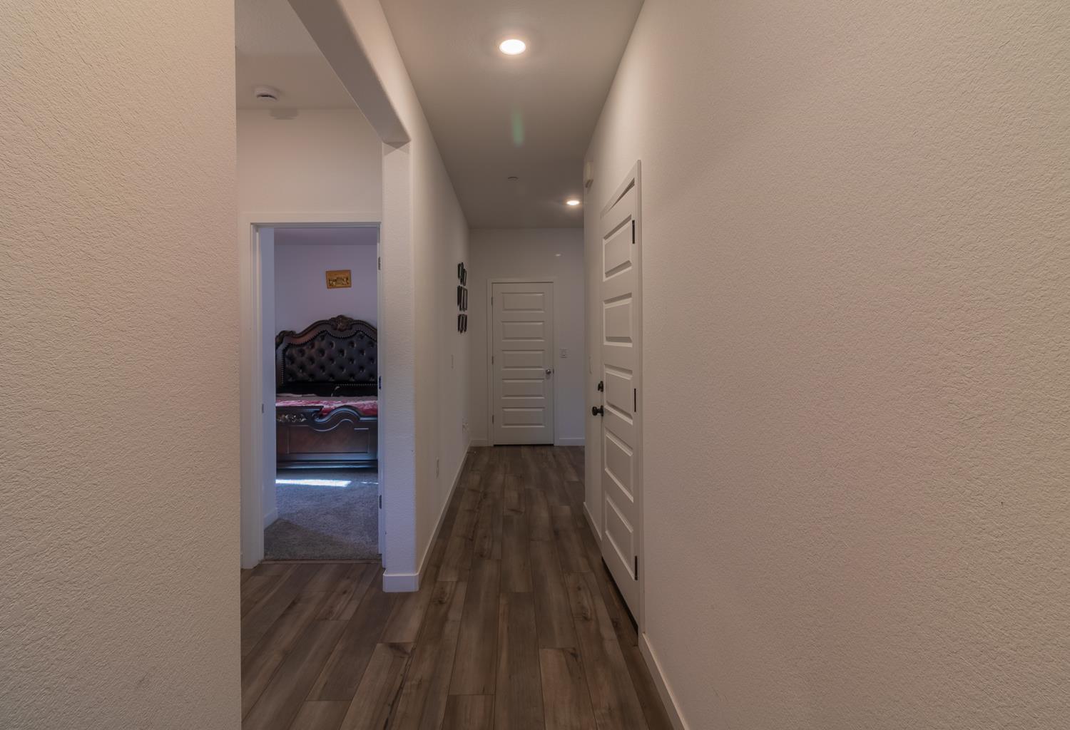 12868 Spotted Wren Circle Rancho Cordova, CA 95742 - Photo 21 of 46 a walk in closet with wooden floor