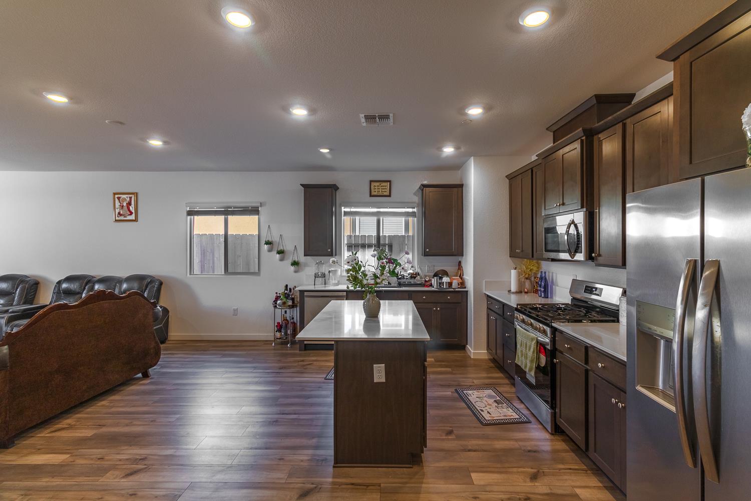 12868 Spotted Wren Circle Rancho Cordova, CA 95742 - Photo 4 of 46 a kitchen with granite countertop stainless steel appliances lots of counter top space