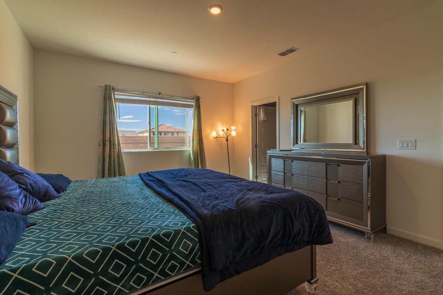 12868 Spotted Wren Circle Rancho Cordova, CA 95742 - Photo 10 of 46 a bedroom with a bed and a window