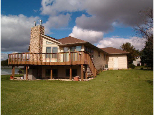 945 Lake Summerset Road Lake Summerset, IL 61019 - Photo 2 of 11 a view of a house with a yard and table