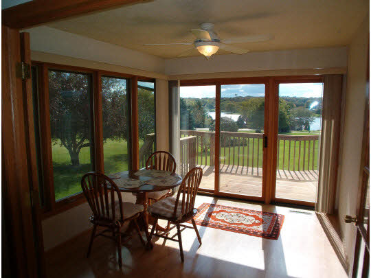 945 Lake Summerset Road Lake Summerset, IL 61019 - Photo 5 of 11 a dining room with furniture and a floor to ceiling window