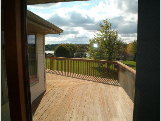 945 Lake Summerset Road Lake Summerset, IL 61019 - Photo 8 of 11 a view of a balcony with wooden floor