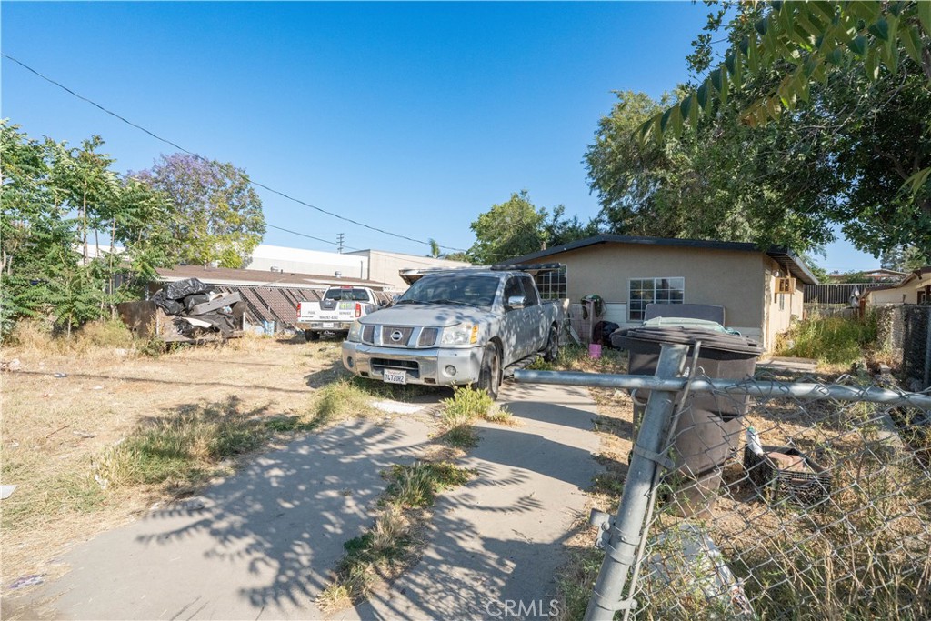 6174 Jurupa Avenue Riverside, CA 92504 - Photo 11 of 30 a view of a patio with table and chairs under an umbrella
