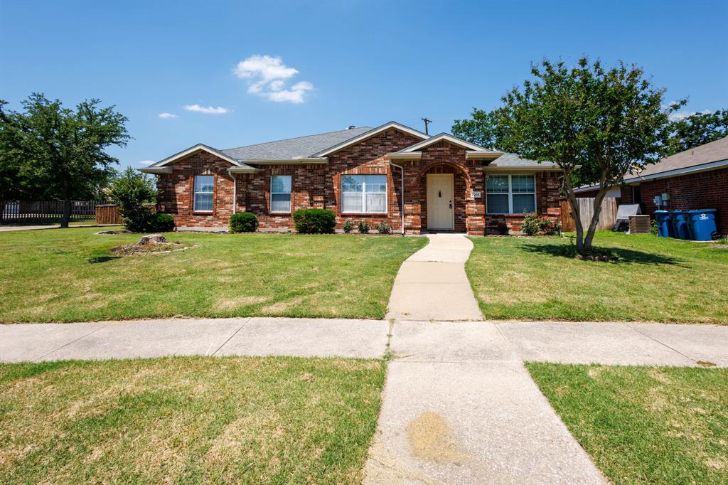 Single story home with brick siding and roof with shingles