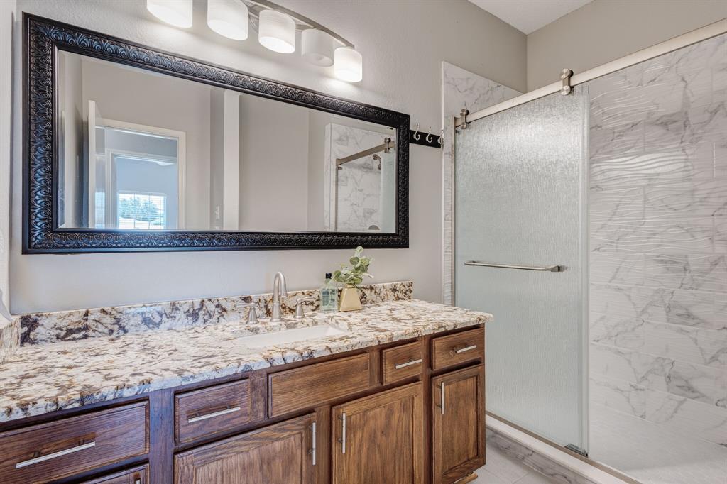 7218 Compass Point Drive Rowlett, TX 75089 - Photo 28 of 30 Full bath with a stall shower and vanity