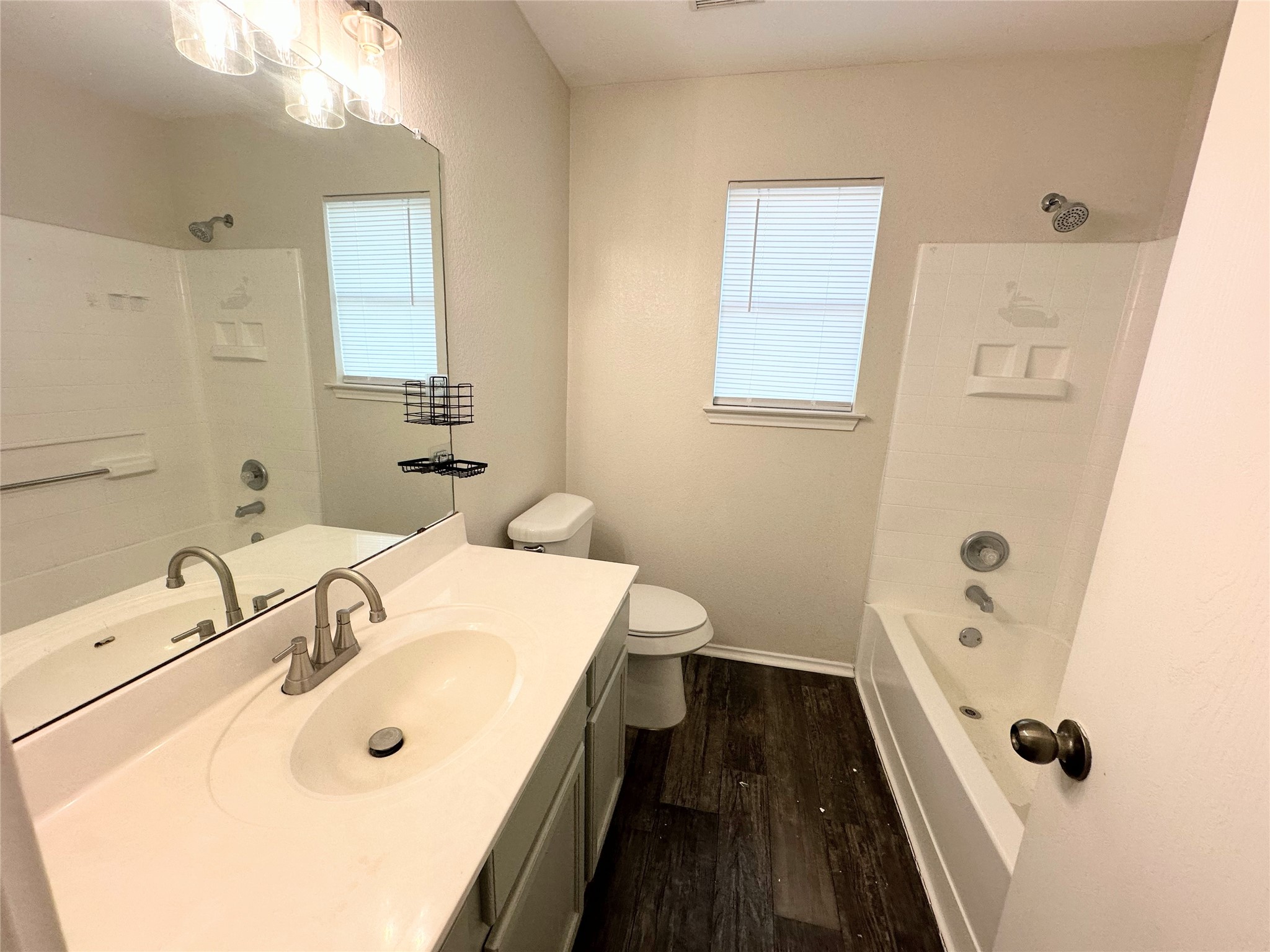 12929 Waynespur Lane Elgin, TX 78621 - Photo 18 of 20 Upstairs Bathroom featuring a vanity with a white countertop and an integrated sink, a large mirror