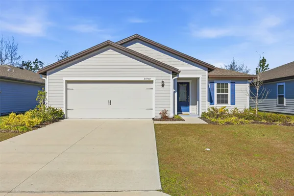 a very nice looking house with a large window