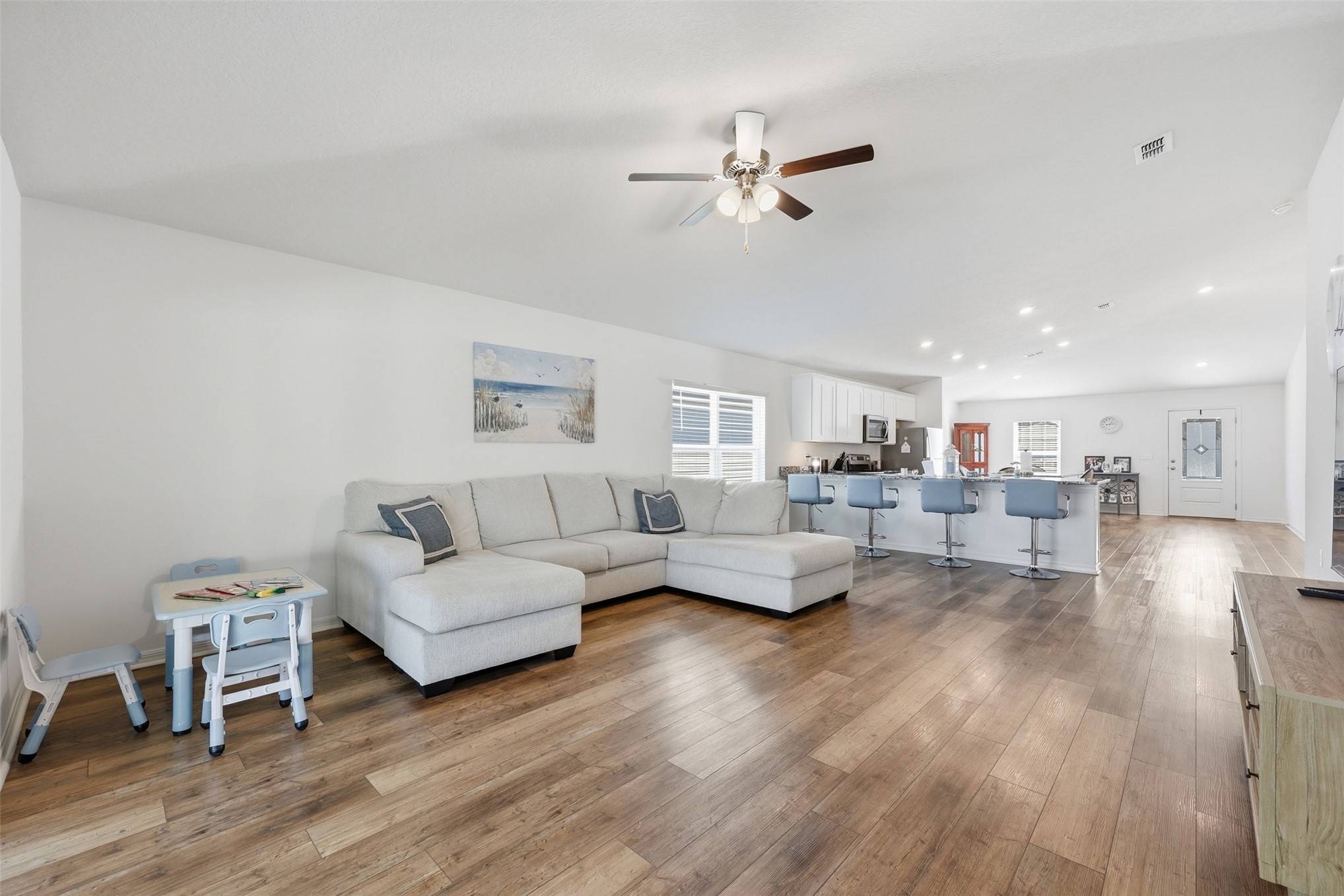37474 Whisper Way Hilliard, FL 32046 - Photo 15 of 31 a living room with furniture and a wooden floor