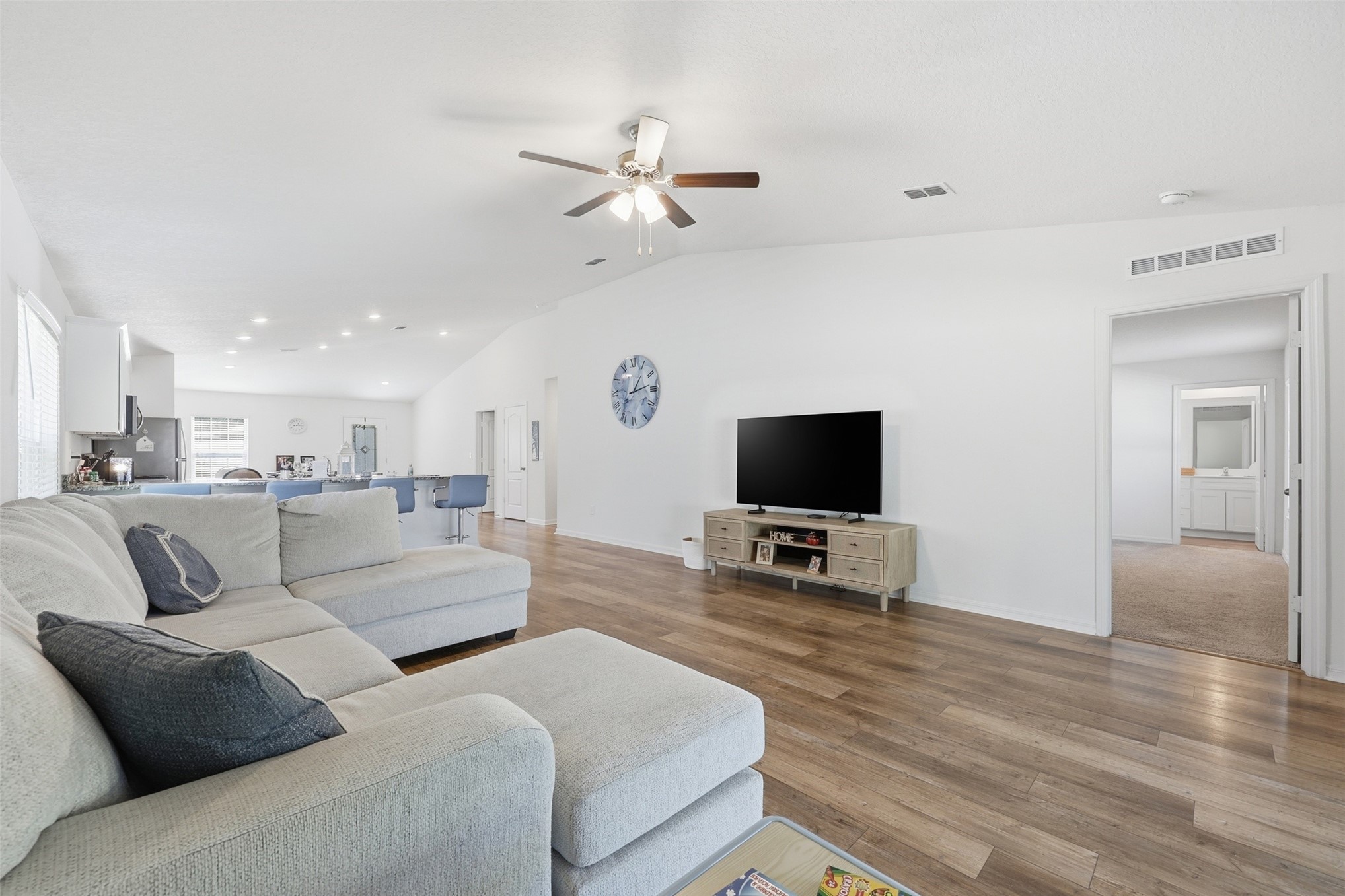 37474 Whisper Way Hilliard, FL 32046 - Photo 16 of 31 a living room with furniture and a flat screen tv