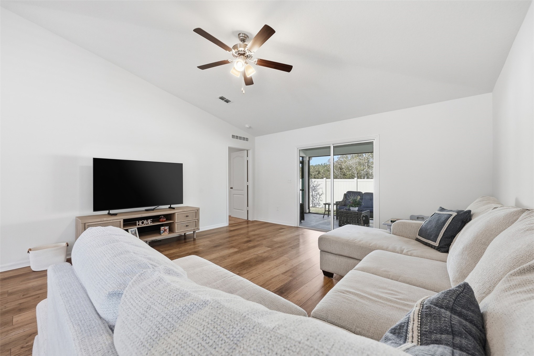 37474 Whisper Way Hilliard, FL 32046 - Photo 17 of 31 a living room with furniture and a flat screen tv