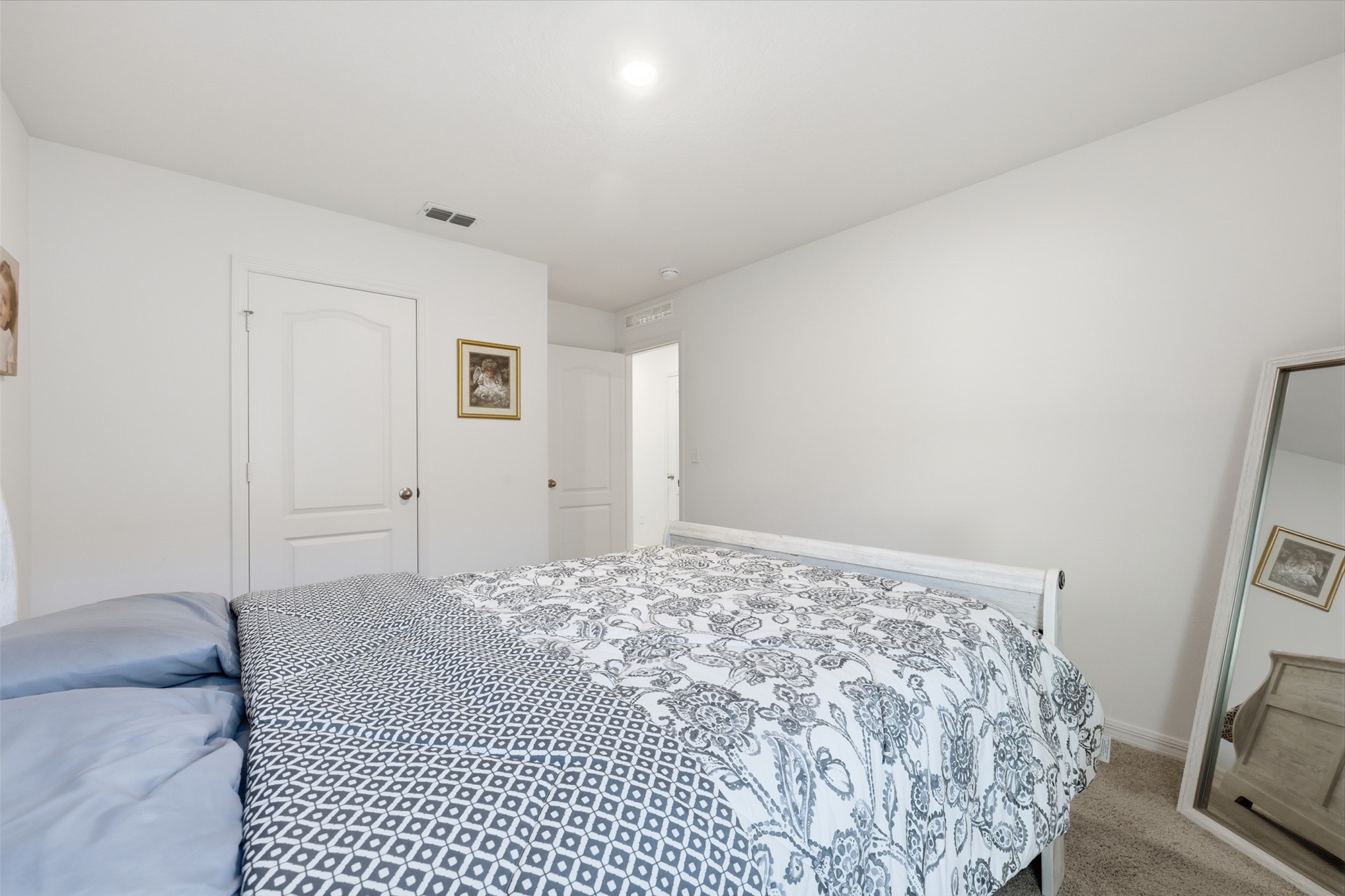 37474 Whisper Way Hilliard, FL 32046 - Photo 23 of 31 a bedroom with a bed and a couch