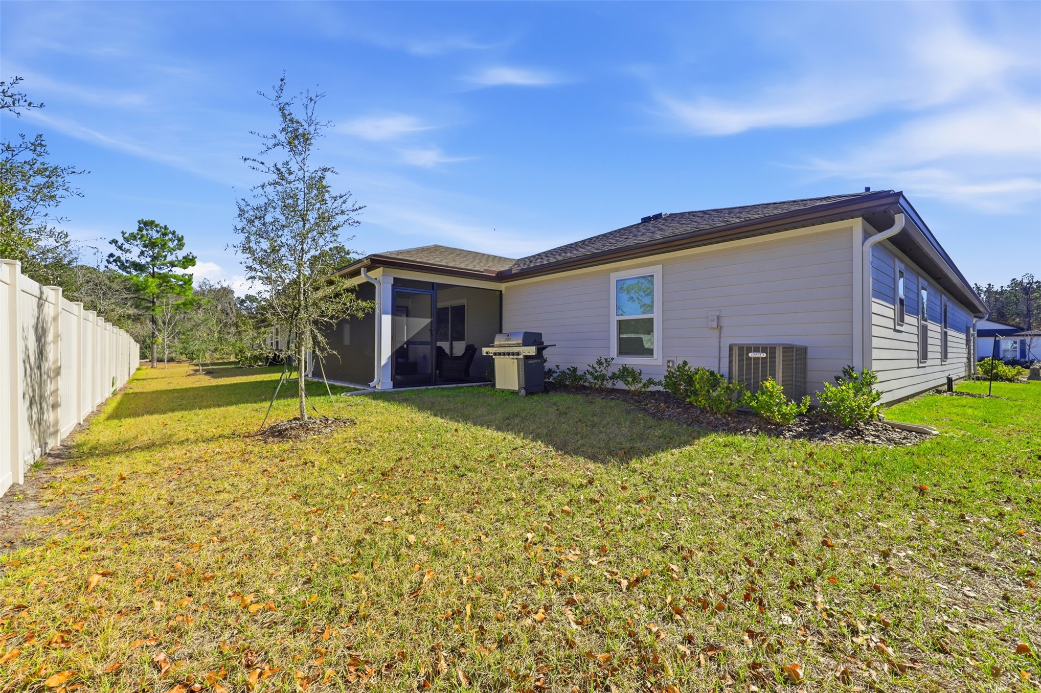 37474 Whisper Way Hilliard, FL 32046 - Photo 29 of 31 a view of a house with a backyard