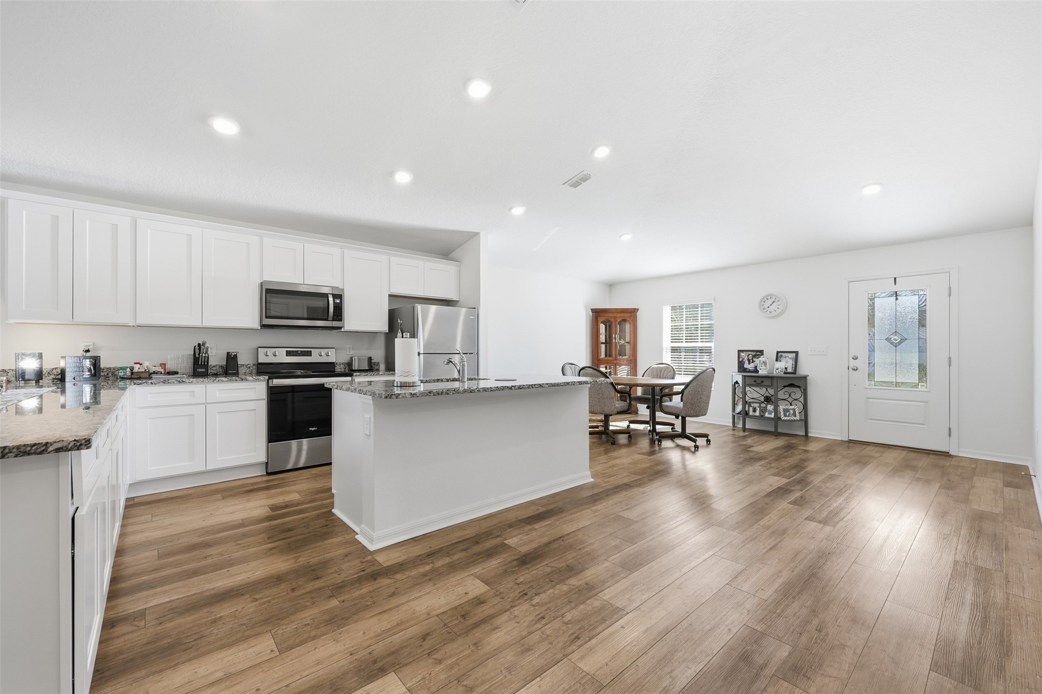 37474 Whisper Way Hilliard, FL 32046 - Photo 8 of 31 a kitchen with cabinets and wooden floor
