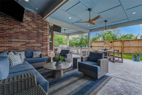 a view of a patio with a table and chairs