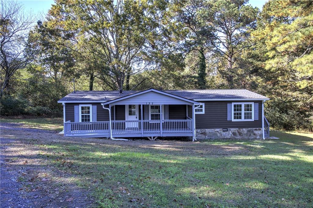 a view of a house with a yard