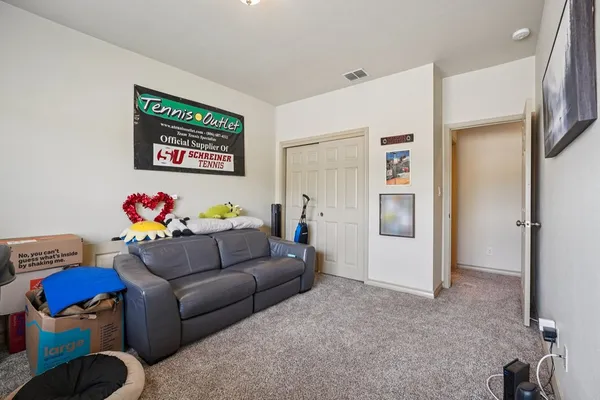 a living room with furniture chess board and a couch