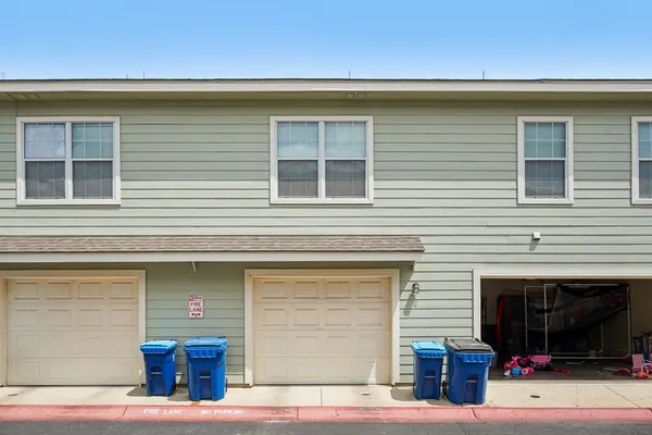 a front view of a house with a garage