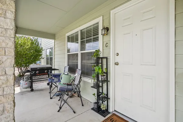 a work room with furniture and a window