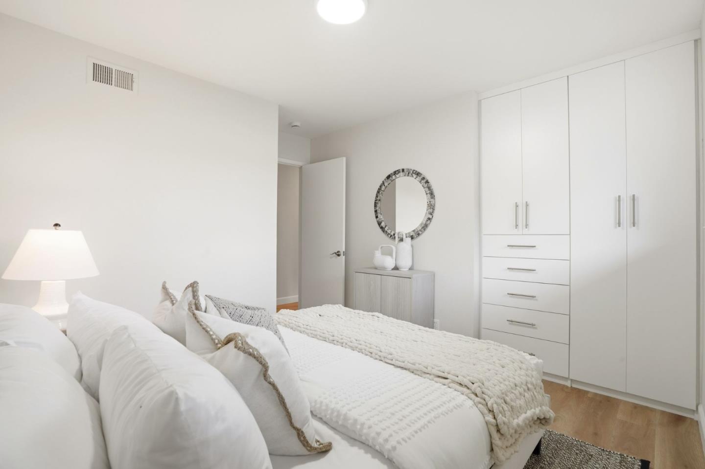 882 San Rafael Avenue Mountain View, CA 94043 - Photo 27 of 50 a bedroom with a bed and a mirror