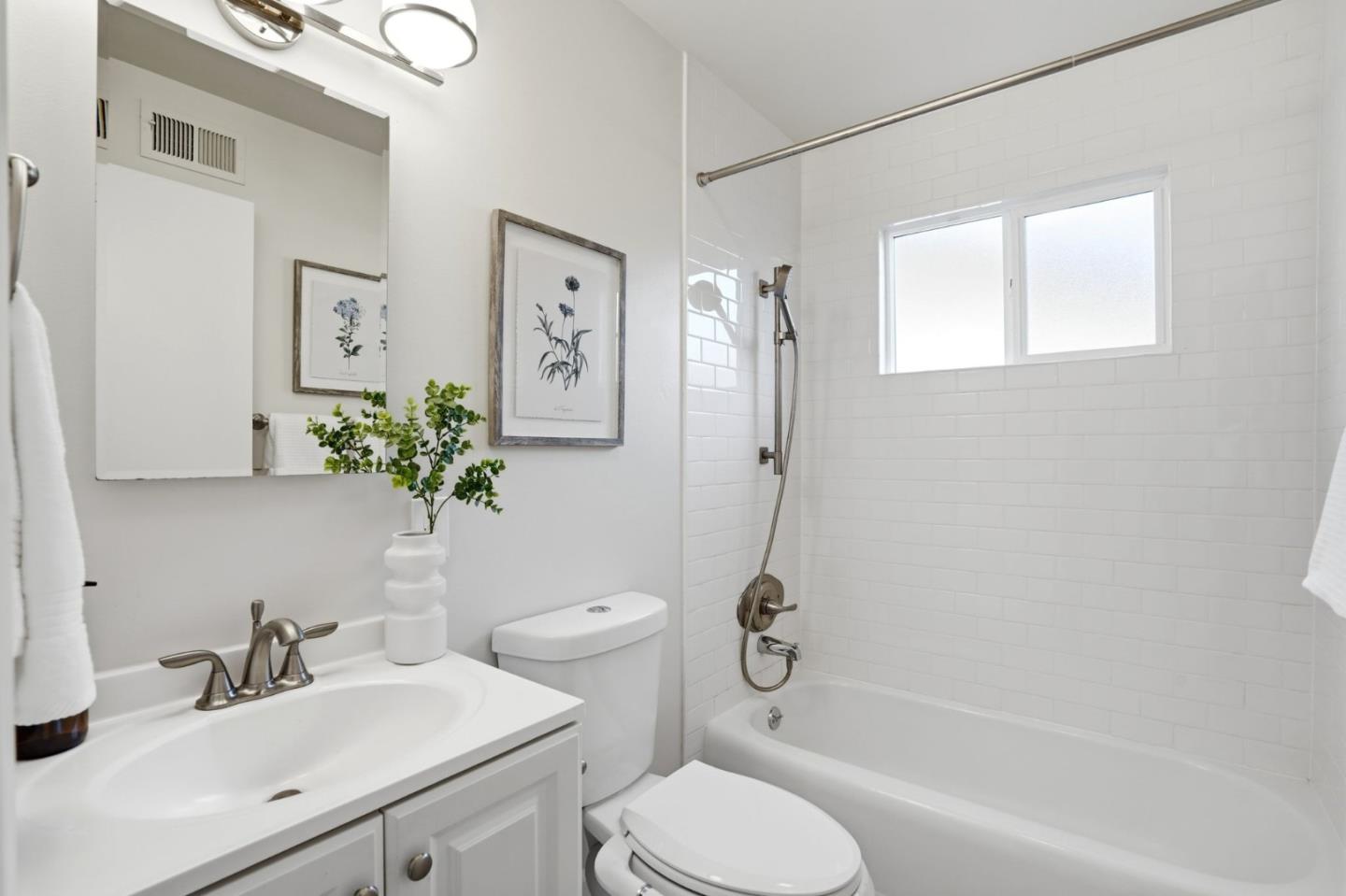 882 San Rafael Avenue Mountain View, CA 94043 - Photo 31 of 50 a bathroom with a sink toilet and shower