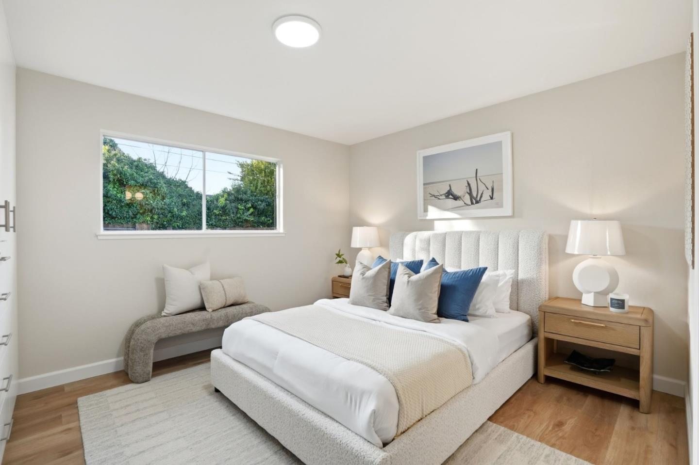 882 San Rafael Avenue Mountain View, CA 94043 - Photo 32 of 50 a bedroom with a bed and wooden floor