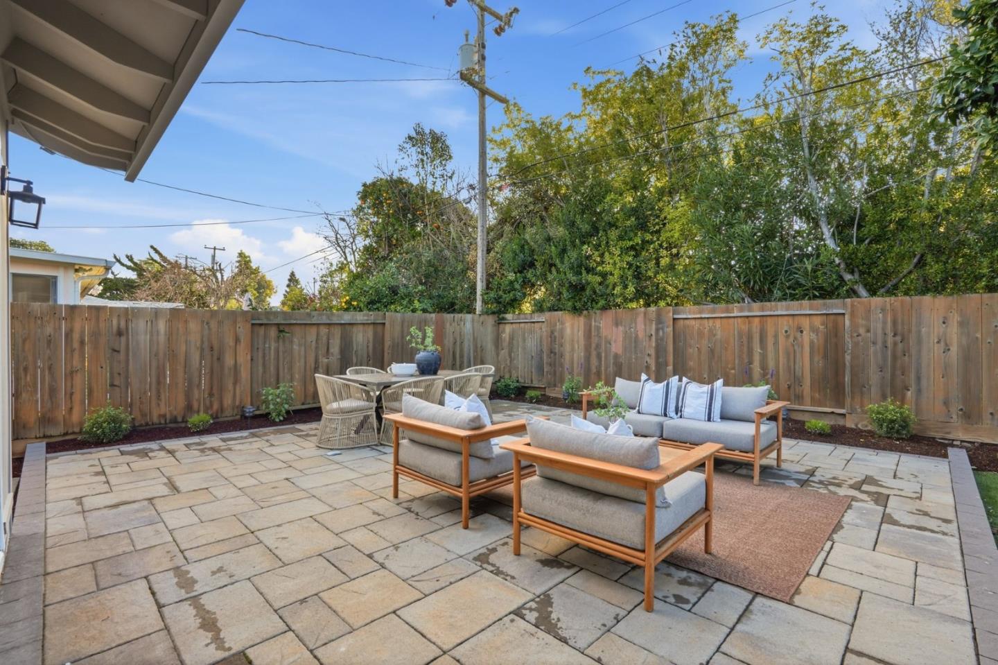 882 San Rafael Avenue Mountain View, CA 94043 - Photo 41 of 50 a backyard of a house with table and chairs