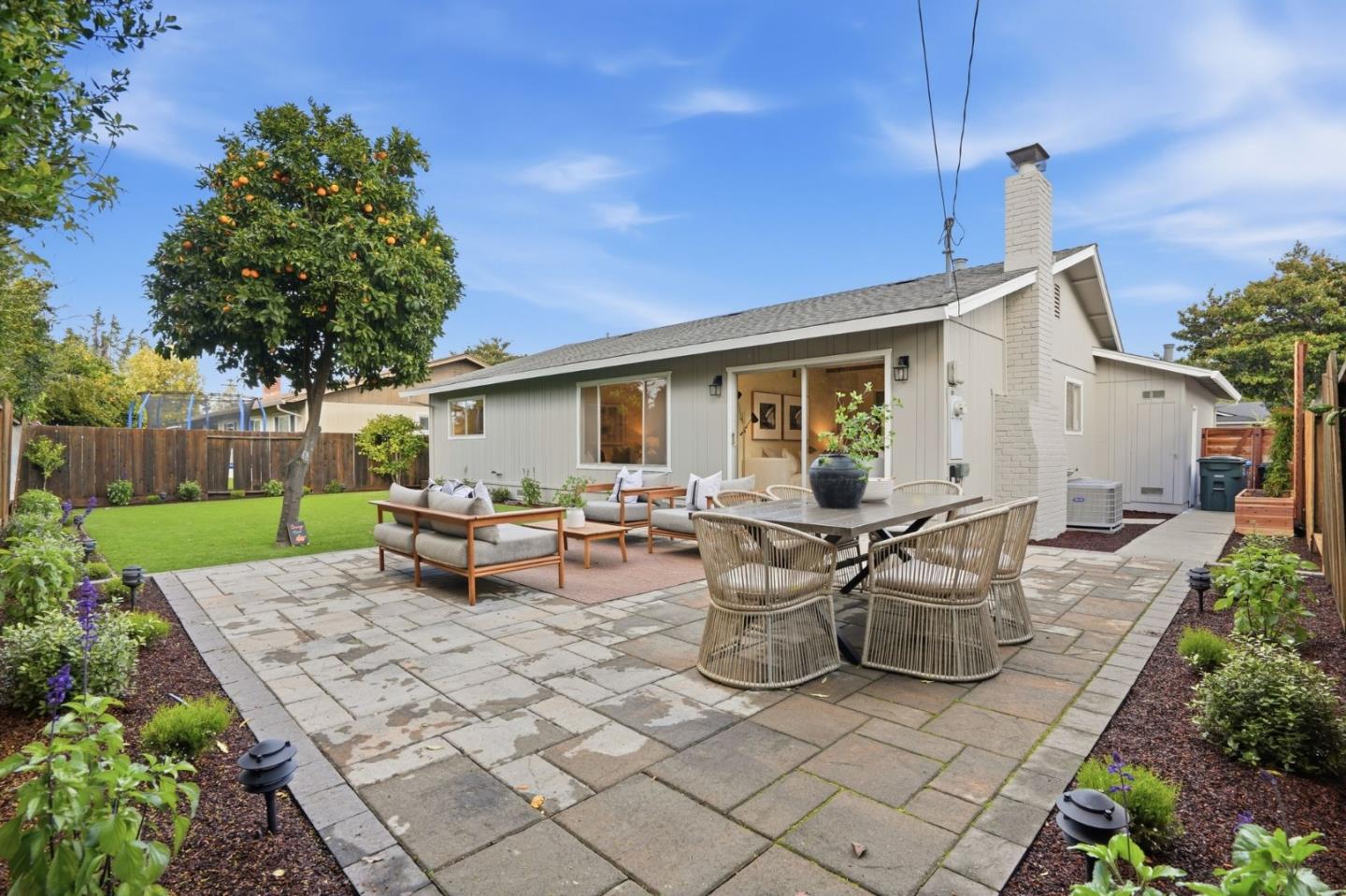 882 San Rafael Avenue Mountain View, CA 94043 - Photo 43 of 50 a view of a patio with table and chairs with a yard