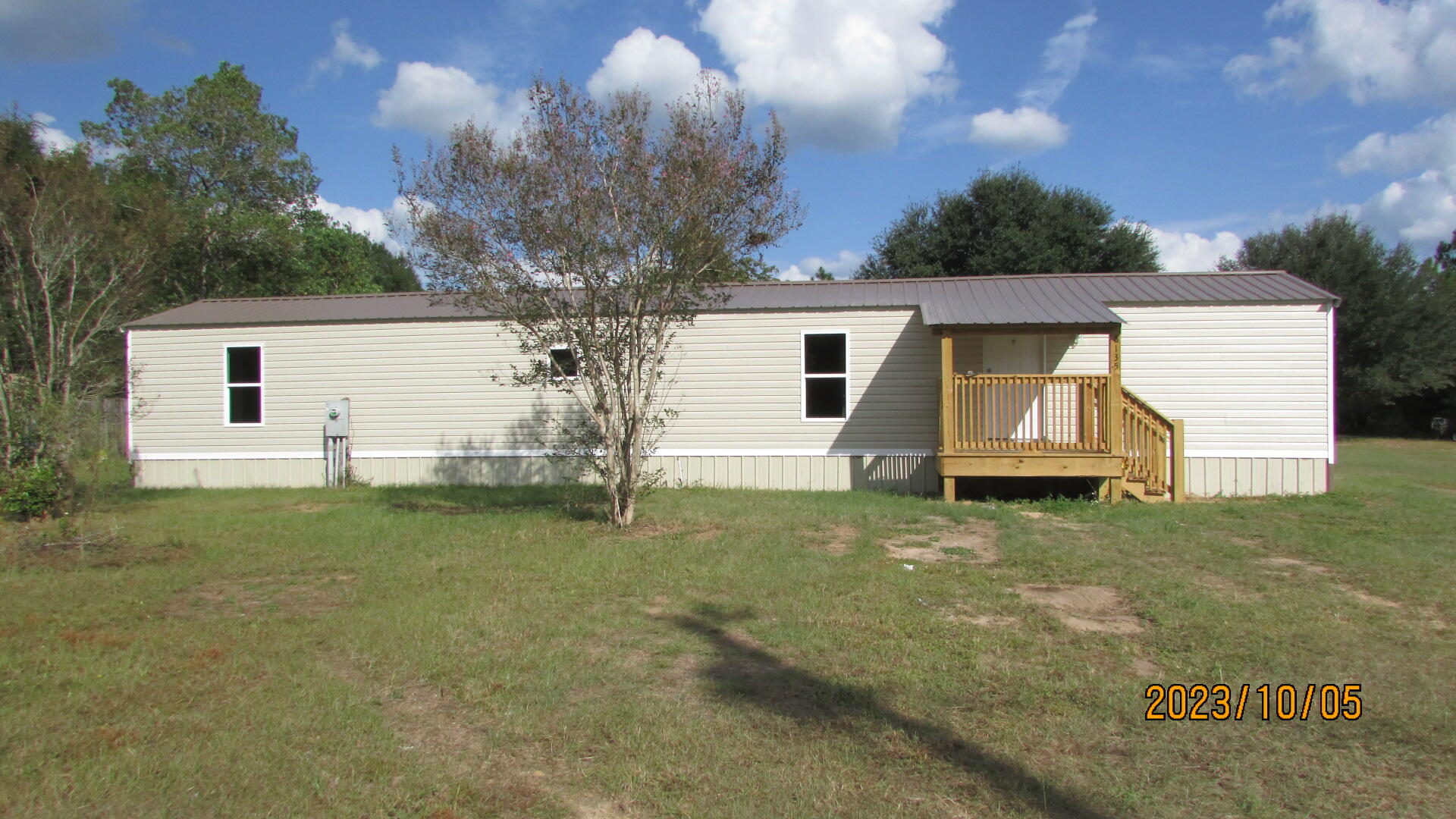 6135 Robin Road Crestview, FL 32539 - Photo 1 of 24 a view of a backyard