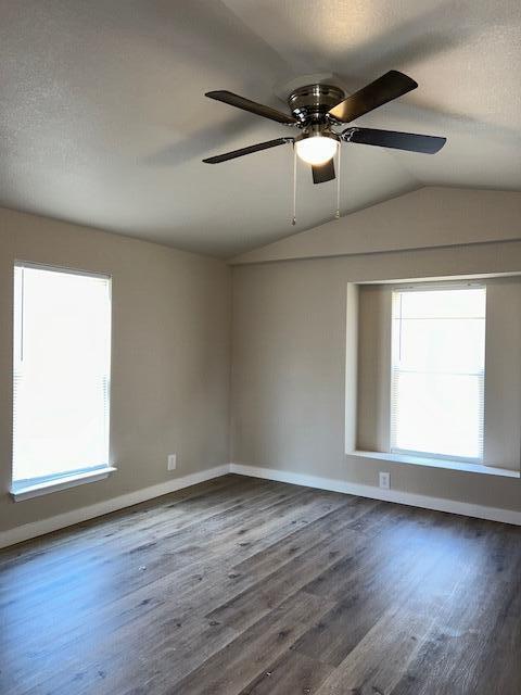 6135 Robin Road Crestview, FL 32539 - Photo 11 of 24 an empty room with wooden floor fan and windows