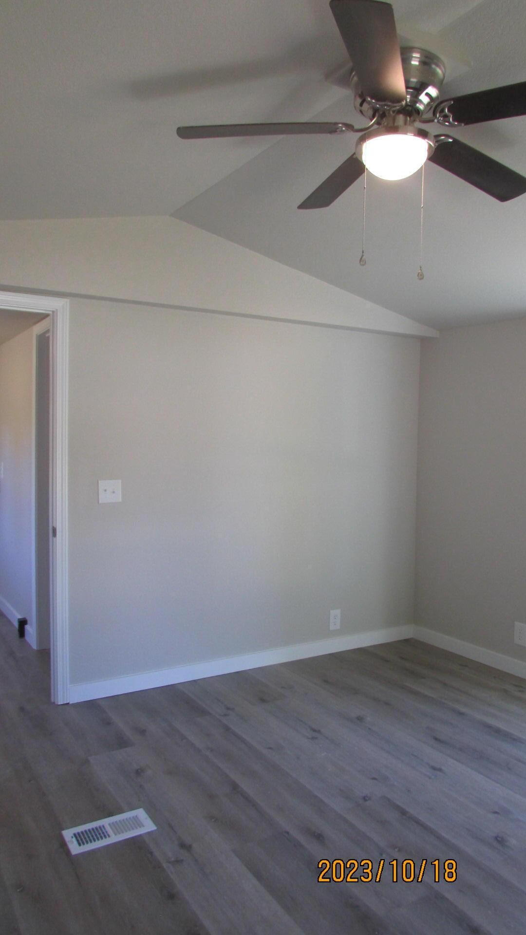 6135 Robin Road Crestview, FL 32539 - Photo 20 of 24 a view of a room with wooden floor and a ceiling fan