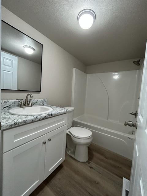 6135 Robin Road Crestview, FL 32539 - Photo 21 of 24 a bathroom with a granite countertop toilet a sink and a mirror