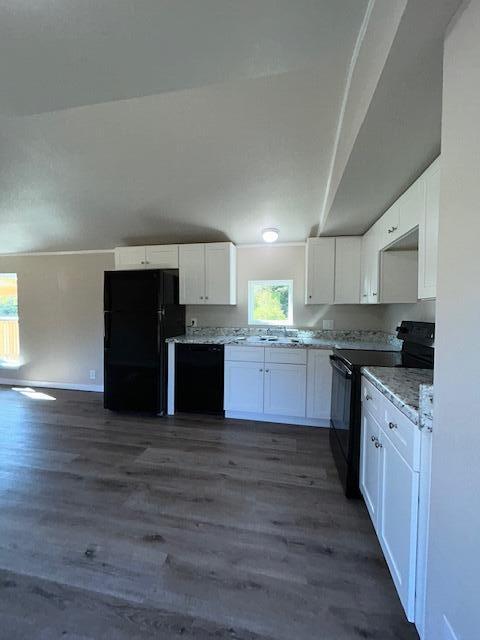 6135 Robin Road Crestview, FL 32539 - Photo 6 of 24 a large kitchen with a center island and a stove