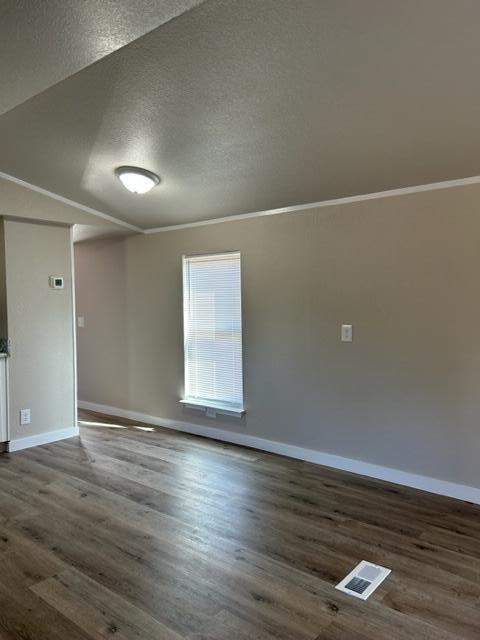 6135 Robin Road Crestview, FL 32539 - Photo 7 of 24 an empty room with wooden floor and windows