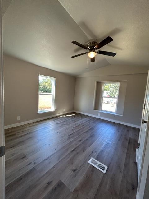 6135 Robin Road Crestview, FL 32539 - Photo 10 of 24 a view of empty room with wooden floor and fan