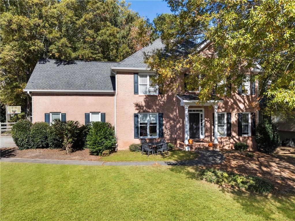 785 Briars Bend Alpharetta, GA 30004 - Photo 1 of 1 a front view of a house with a yard