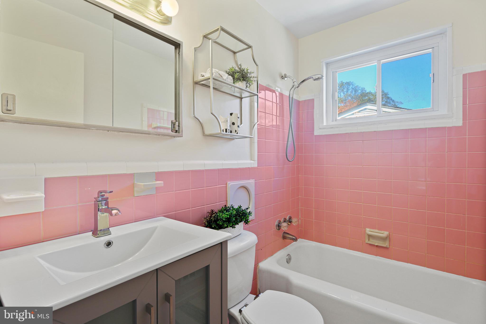 12910 Crisfield Road Silver Spring, MD 20906 - Photo 16 of 30 a bathroom with a sink vanity tub and toilet