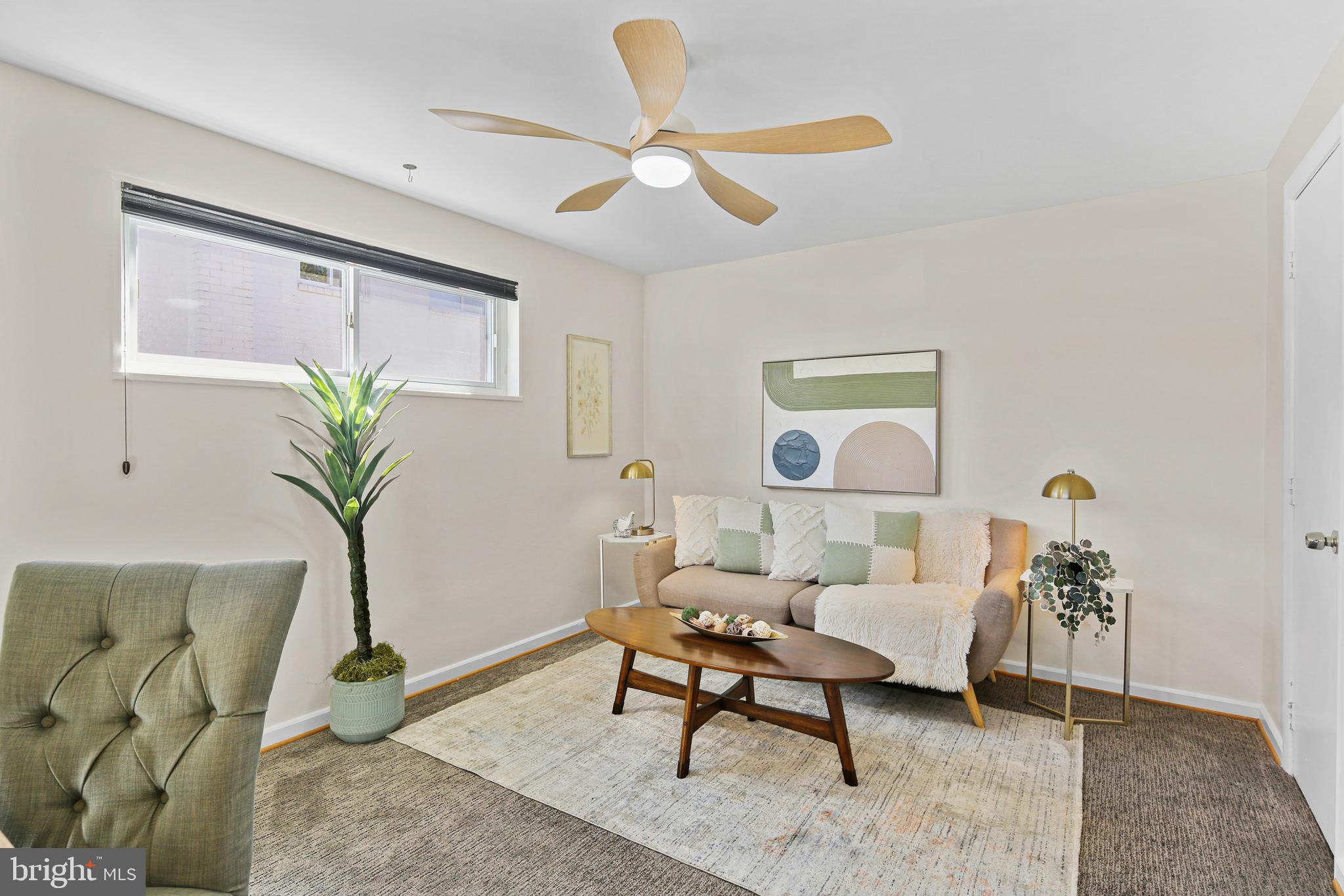 12910 Crisfield Road Silver Spring, MD 20906 - Photo 5 of 30 a living room with furniture and a potted plant