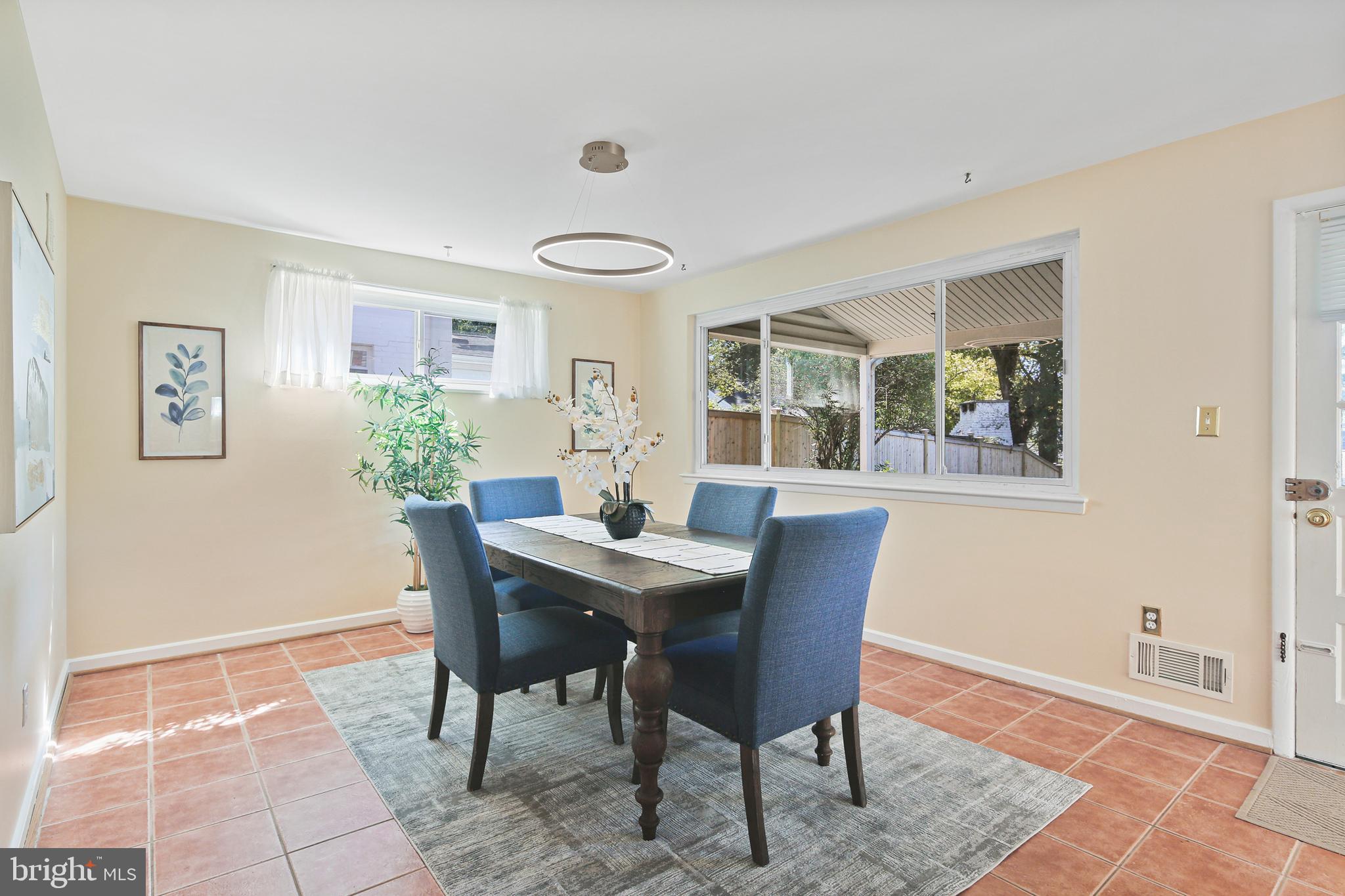 12910 Crisfield Road Silver Spring, MD 20906 - Photo 10 of 30 a view of a dining room with furniture window and wooden floor