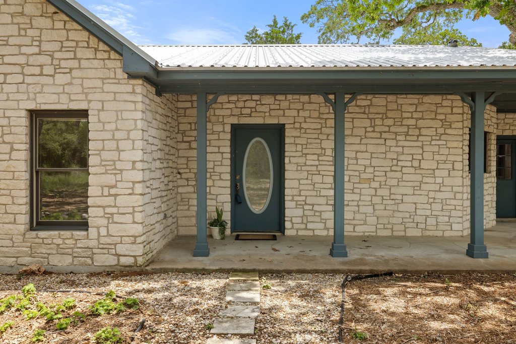 244 Woodway Elgin, TX 78621 - Photo 7 of 40 a front view of a house with a garden