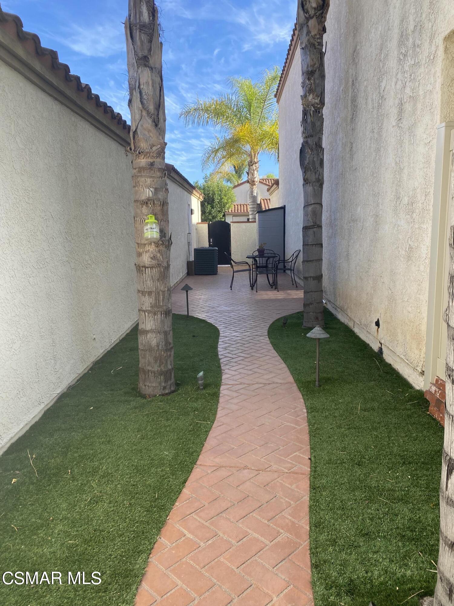 801 Congressional Road Simi Valley, CA 93065 - Photo 18 of 22 a view of a patio with a table and chairs potted plants