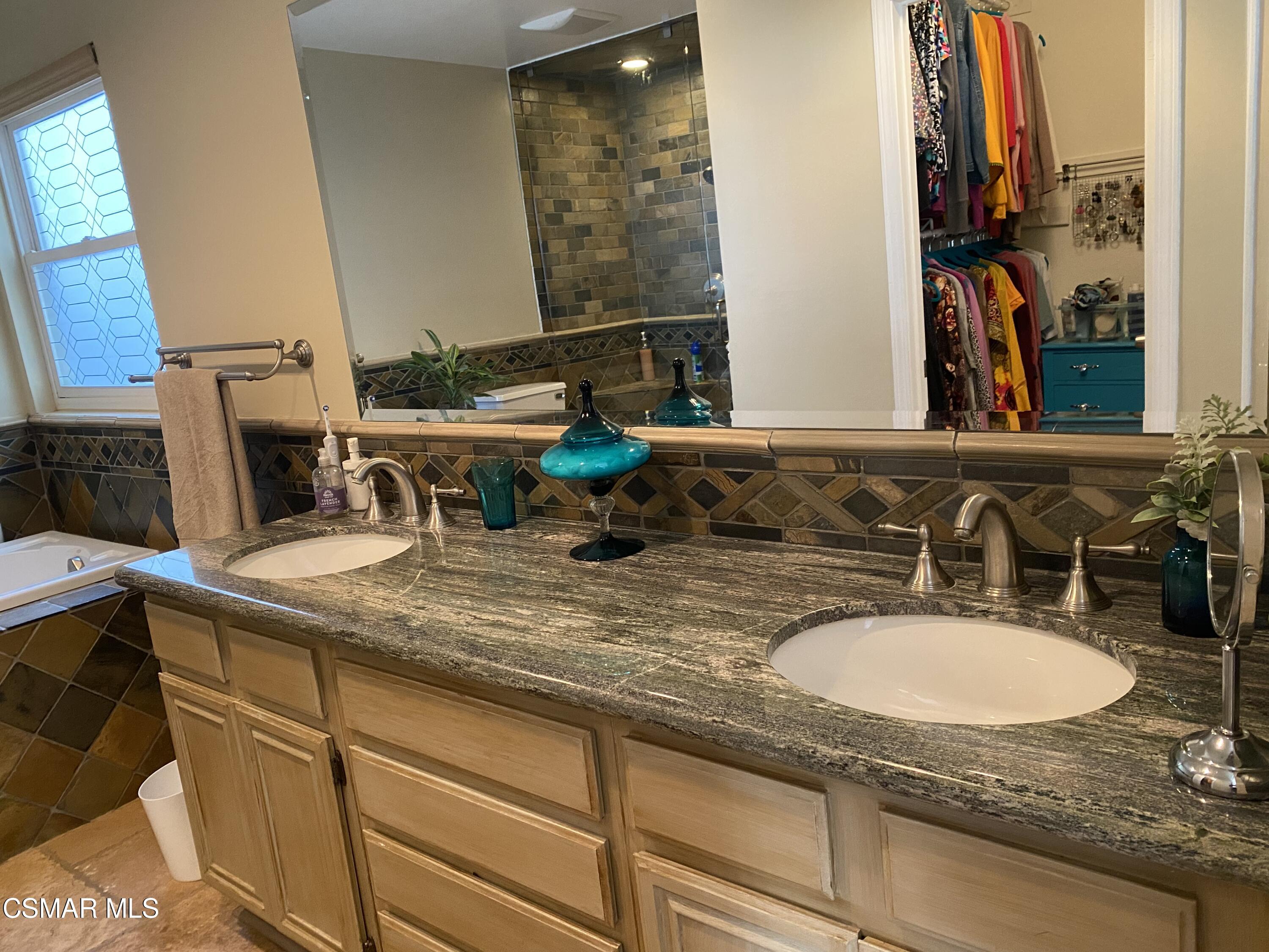 801 Congressional Road Simi Valley, CA 93065 - Photo 7 of 22 a bathroom with a sink and a mirror